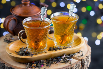 Sweet, hot tea with dessert, on an old background.