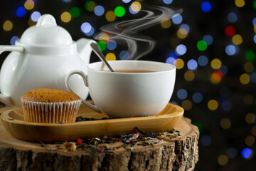 Obraz na płótnie Canvas Sweet, hot tea with dessert, on an old background.