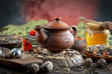 Dried tea leaves in a spoon, on an old background.