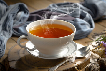 Sweet, hot tea with dessert, on an old background.
