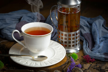 Sweet, hot tea with dessert, on an old background.