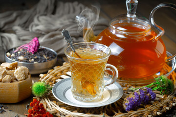 Sweet, hot tea with dessert, on an old background.