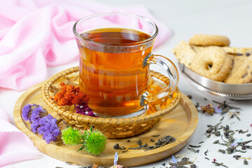 Sweet, hot tea with dessert, on an old background.