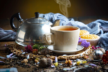 Obraz na płótnie Canvas Sweet, hot tea with dessert, on an old background.