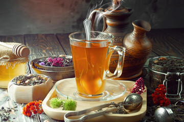 Hot sweet tea in a cup on old background