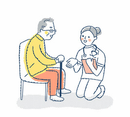 シニア男性としゃがんで話す医療従事者