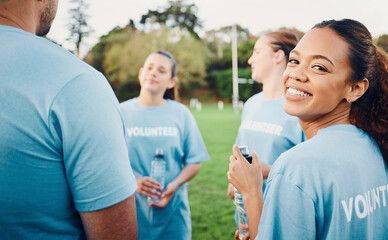 Portrait, smile and volunteer woman with team outdoors for climate change, charity cleaning and recycling. Earth day, community service and happy female with group of environmental people at park.