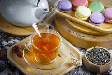Sweet, hot tea with dessert, on an old background.