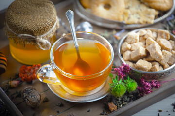 Sweet, hot tea with dessert, on an old background.