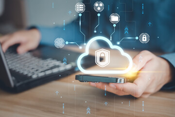 Concept of cloud technology security system, online data storage. Man using cloud computing for back up and transfer electronic data via mobile phone.