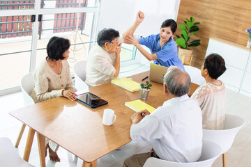 Fototapeta premium Nursing Home Care concept. A group of elderly people in nursing homes meeting with nursing care assistants