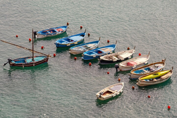 Fototapeta na wymiar Aerial view of Vernazza bay and boats on the water Cinque Terre Italy