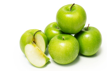 Green apples stacked isolated on white background