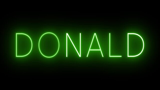 Flickering green retro style neon sign glowing against a black background