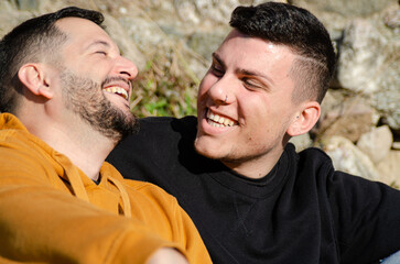 Couple of two men in love and happy laughing. Homosexuality and LGBTQ+ concept.