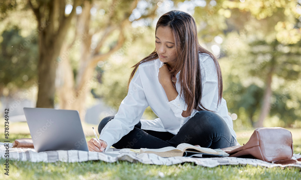 Poster Nature, laptop and student studying in the park for a university test, exam or assignment. Technology, outdoor and woman writing notes while working on a college project with a computer in a garden.