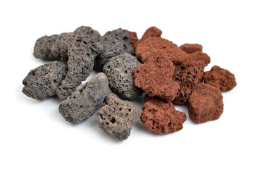 Porous black and brown volcanic rock. Lava stone, pumice stone, or volcanic pumice with distinctive...