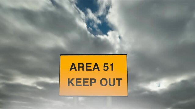 Zoom into a simulation of a secret military base Area 51 Keep Out sign with a cloud timelapse background.