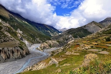 Fototapeta premium View of the Marshyangdi (Marsyangdi) River valley. Rocky valley of the Marshyangdi river with blue sky in the background. Manang District, Nepal, Asia.