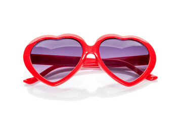 Heart shaped sunglasses with red frames isolated on white background with clipping path.