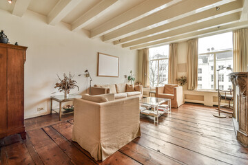 a living room with wood flooring and large windows overlooking the cityscapea, new york, ny
