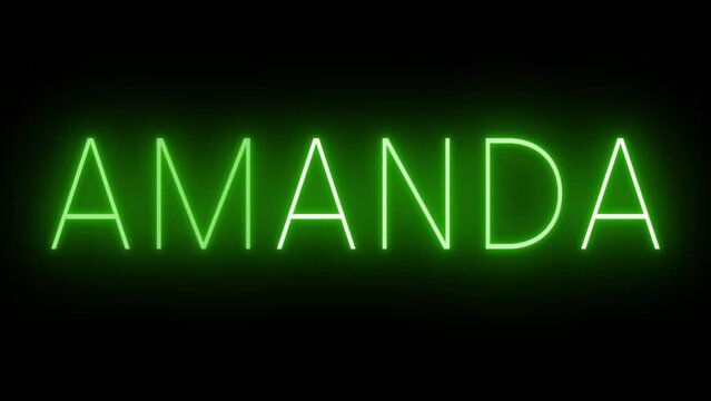 Flickering green retro style neon sign glowing against a black background