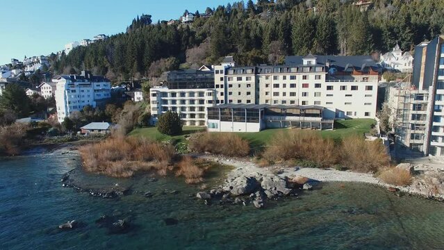 This dynamic and picturesque video showcases the beauty of Bariloche city and Lake Nahuel Huapi in Patagonia, surrounded by mountains, forests, and alpine architecture.
