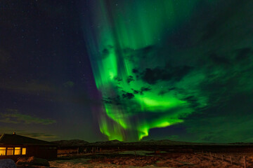 Obraz na płótnie Canvas Northern lights in the night sky in Iceland.