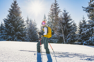 Mountaineer backcountry ski walking ski alpinist in the mountains. Ski touring in alpine landscape with snowy trees. Adventure winter sport. Kralova hola, Slovakia © Zedspider