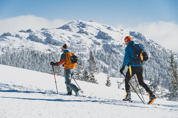 Mountaineer backcountry ski walking ski alpinist in the mountains. Ski touring in alpine landscape with snowy trees. Adventure winter sport. Kralova hola, Slovakia © Zedspider
