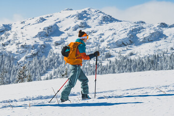 Mountaineer backcountry ski walking ski alpinist in the mountains. Ski touring in alpine landscape with snowy trees. Adventure winter sport. Kralova hola, Slovakia © Zedspider