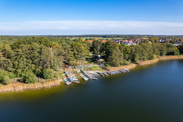 Drone footage of a pier with boats lined up in Lake. Germany.