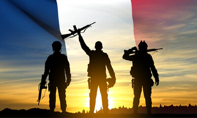 Fototapeta na wymiar Silhouettes of French soldiers on background of sunset and French flag. Concept - Armed Forces. EPS10 vector