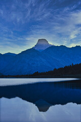 Reflection of the mountains in the lake with blue sky and cloudsMountains reflecting in a lake at sunset, South Island, New Zealand