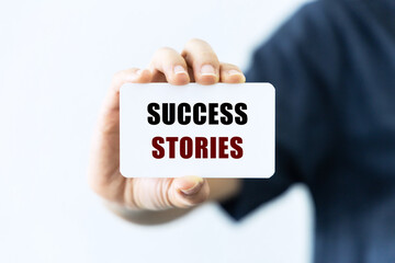 Success stories text on blank business card
