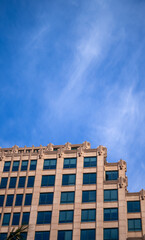 Brown Building Wall Under Construction with Blue Sky Overhead.