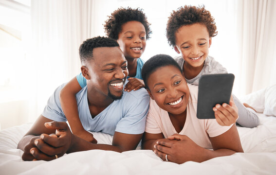 Happy, selfie and relax with black family in bedroom for bonding, social media and connection. Wake up, morning and affectionate with parents and children at home for weekend, picture and happiness
