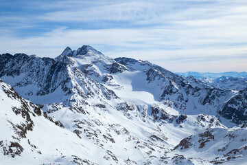 Fototapeta na wymiar Panoramic view of Alps mountain snowy range with skiing trails, Stubai Glacier, Austria
