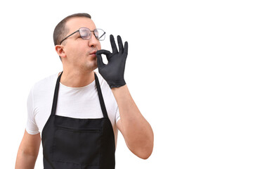 Naklejka premium Professional chef in an apron gesturing with his hands on a white background. The concept of cooking