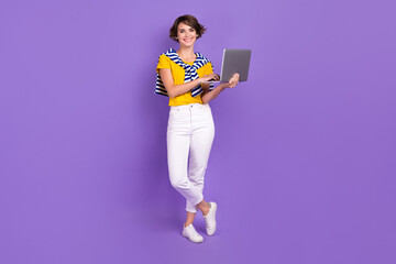 Full length photo of adorable lovely lady hipster wear trendy outfit use modern device gadget isolated on purple color background