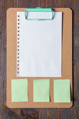 Clip board with blank paper and notes