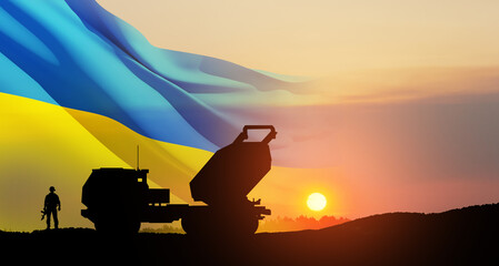 Fototapeta na wymiar Artillery rocket system are aimed to the sky and soldier at sunset with Ukrainian flag. Multiple launch rocket system.