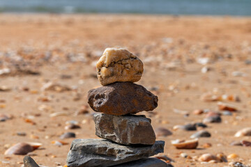 Stone scales on the beach. Zen meditation and relaxation.