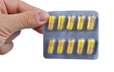 Hand holding pills isolated on transparent background, PNG.