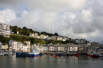 Fototapeta na wymiar Small fishing port of Luarca, Spain, with the characteristic residential buildings in the background