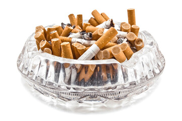 Crystal dirty ashtray full of cigarette butts on white background