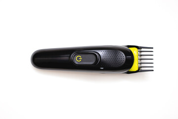 Razor trimmer for cutting hair lies on a white background. Electric shaver for barbershop....