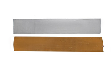 Two strips of adhesive tape on a white background. Brown and gray sticky tape. Stationery and construction adhesive tape are glued for comparison. Various applications of adhesive tape