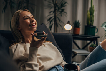 A young blonde woman enjoys a phone call