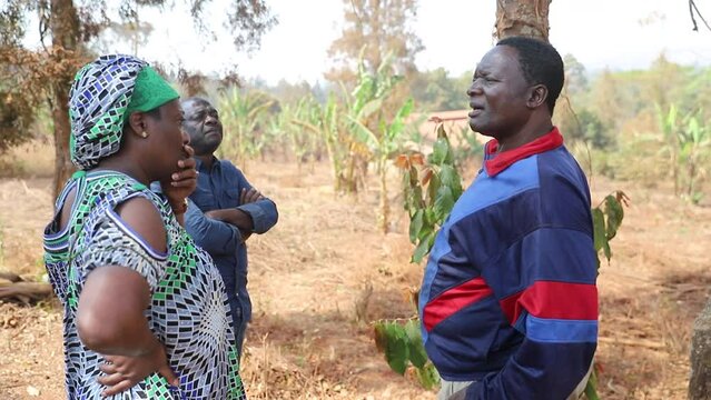 An African farmer talks about work with his collaborators in the fields